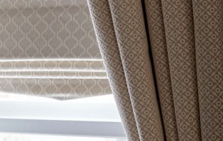 Matching patterned curtains and roman blinds
