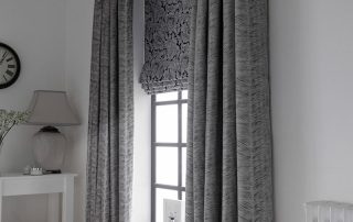 Matching grey curtains and roman blinds