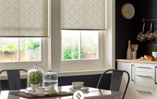 Patterned white roller blinds in kitchen