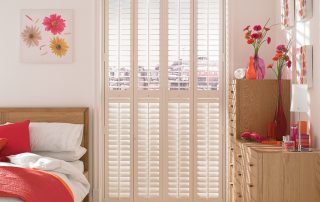 White shutters in a bedroom