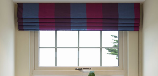 Roman blinds in shades of purple and blue