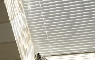 Close up of white venetian blinds