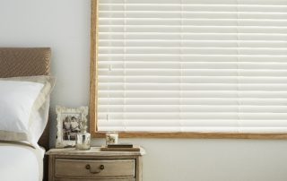 White venetian blinds in bedroom
