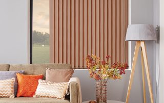 Partially drawn beige vertical blinds