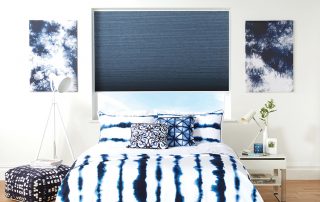 Blue Duette blinds above bed